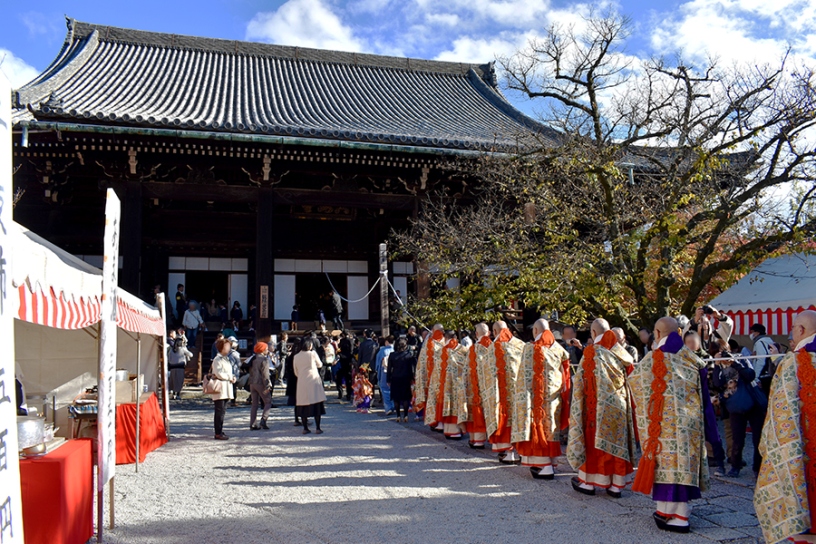 Lantern-lit approach and worshippers gathering for evening prayers