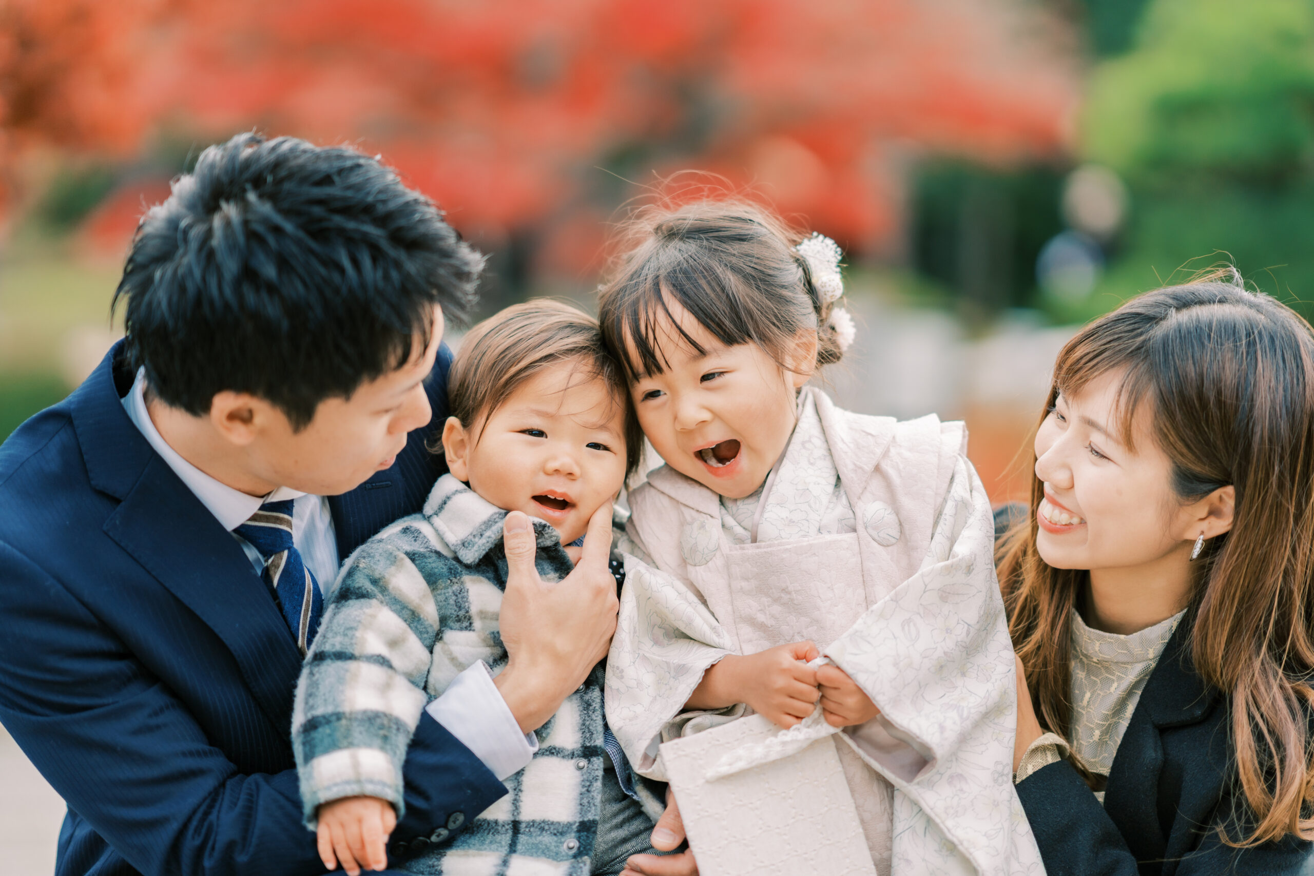 Family wide shot on riverside path, Kyoto