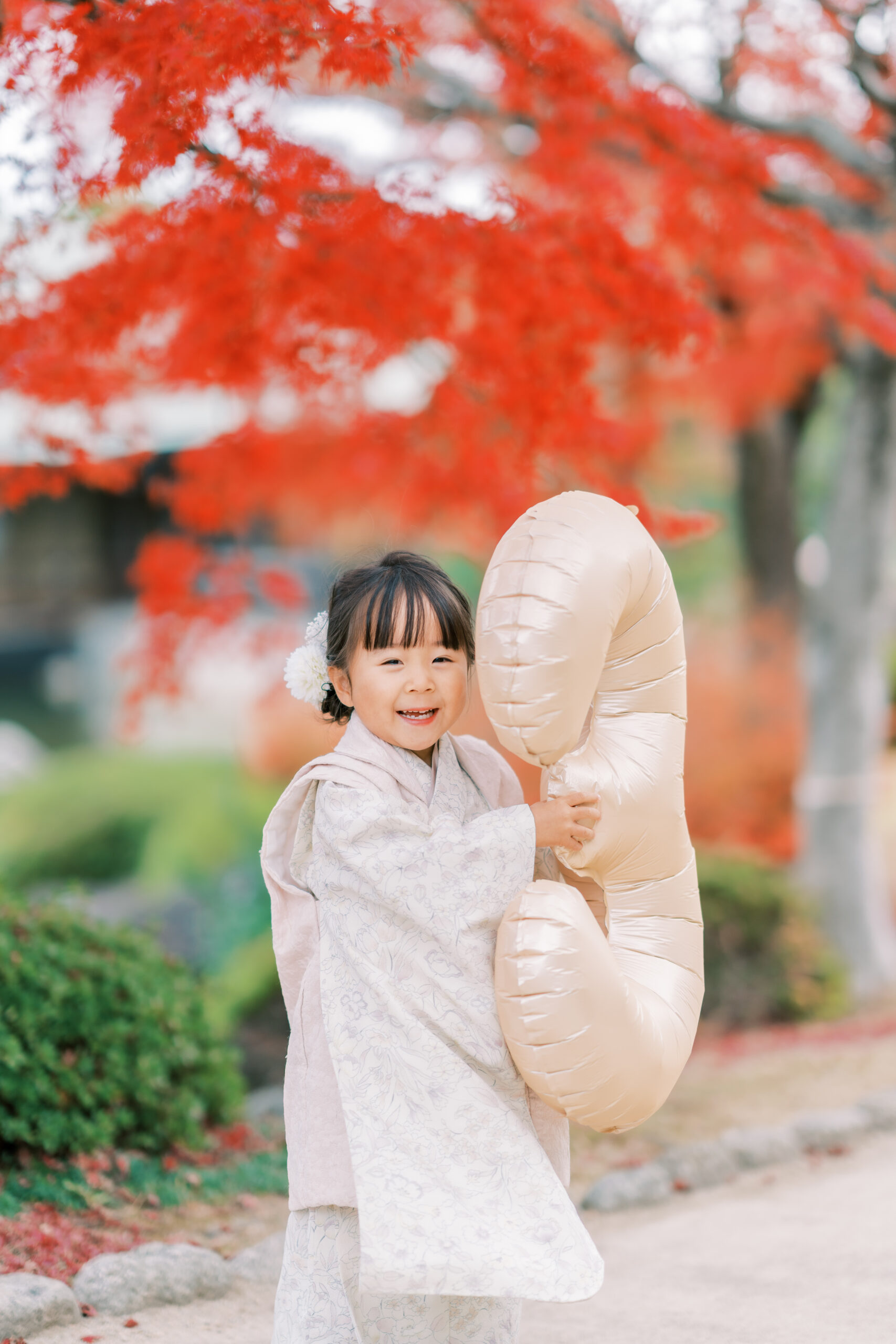 Family cuddles by the riverside, soft light