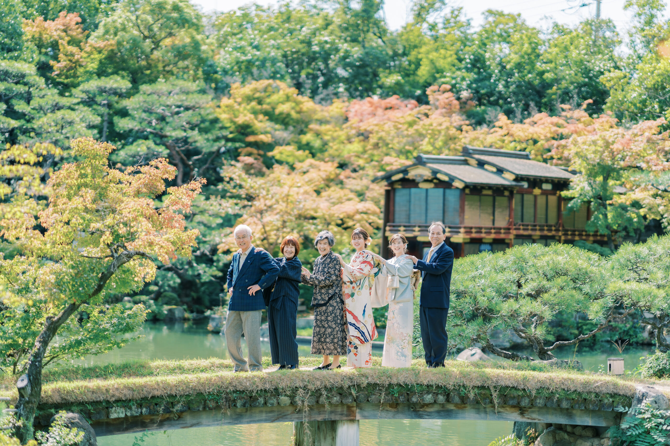 Gentle embrace with red leaves backdrop, intimate autumn portrait